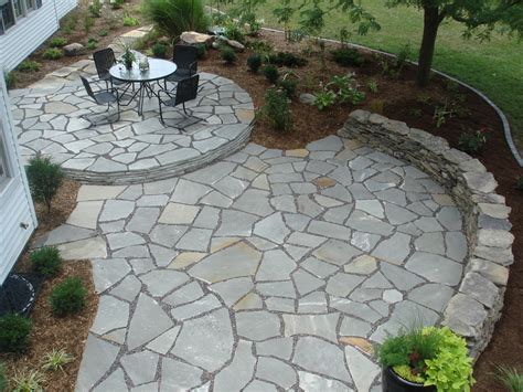 Create a cozy and inviting atmosphere with a stone patio